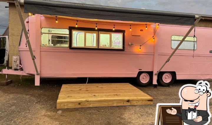 Actual supplied Auntie K’s pink coffee trailer with its service window and wooden platform